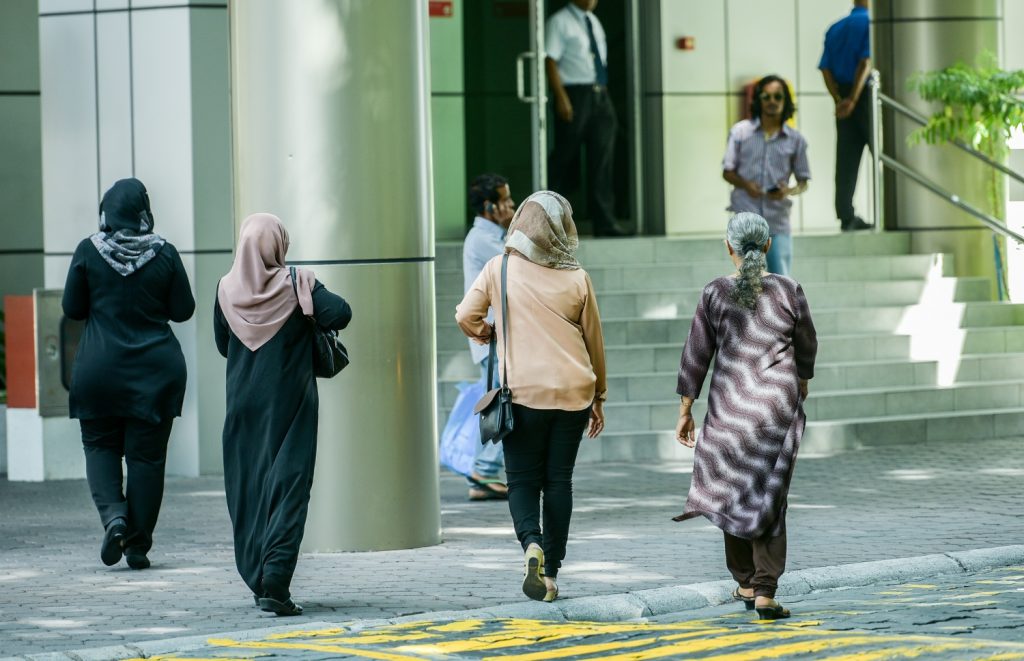 Women going to work in the capital Malé City.